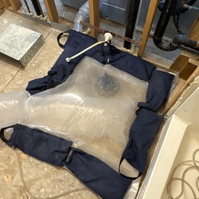 Containment system used during sewage extraction and biohazard cleanup after septic line failure